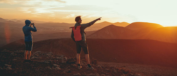 Couple walking down a street.